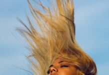 건강한 모발을 위한 생활습관, 매일 실천하는 헤어 케어 방법 woman wearing yellow halter top whipping hair