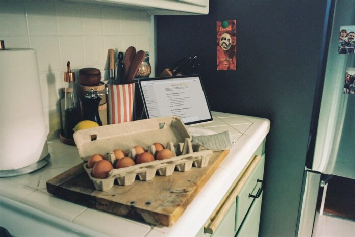 Carton of brown eggs on a kitchen counter